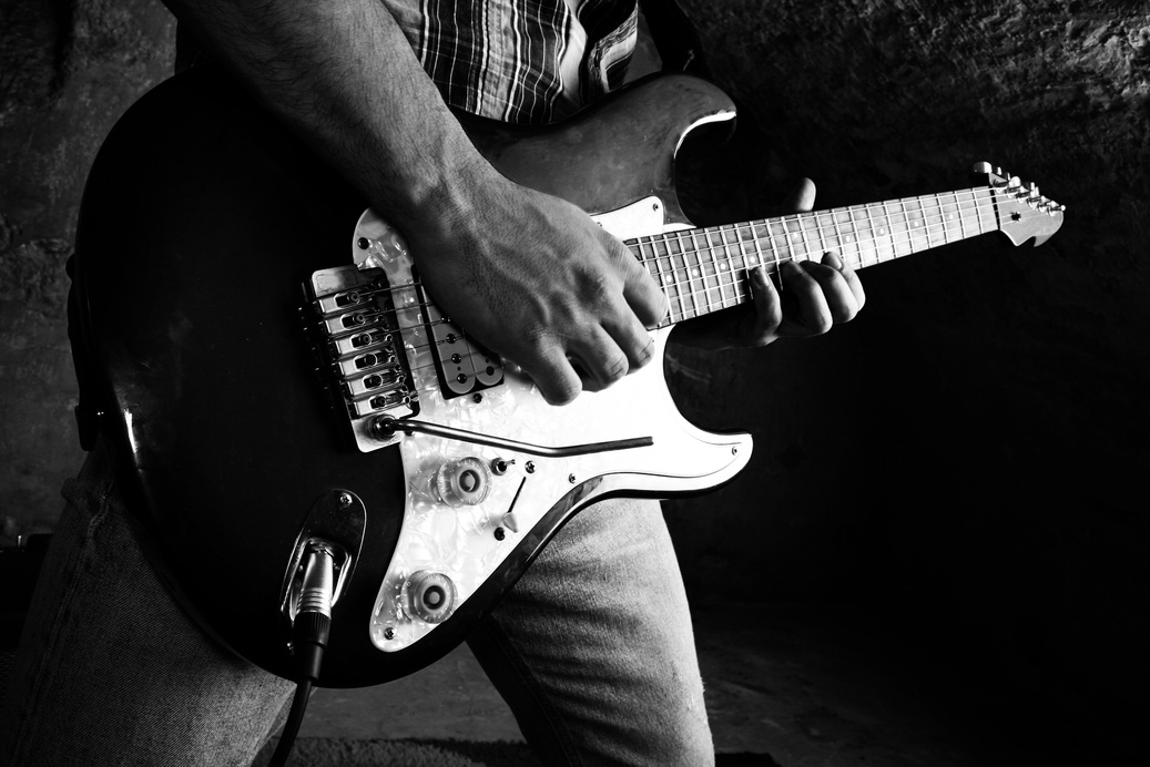 Black and white photo of elecrical guitarist